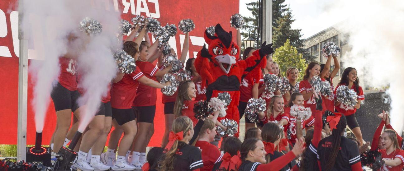 The Carthage College spirit team reveals Ember, the new Firebirds mascot, during 首页coming Weeke...